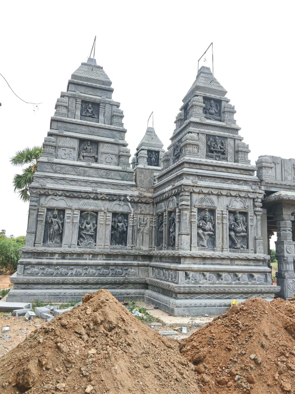 Angled view showing the temple's tiered towers and reliefs