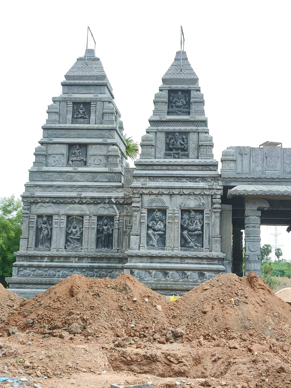 Front view of the Shivalayam's twin carved towers
